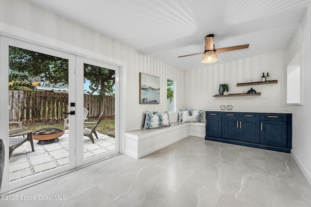 interior space with a healthy amount of sunlight and ceiling fan