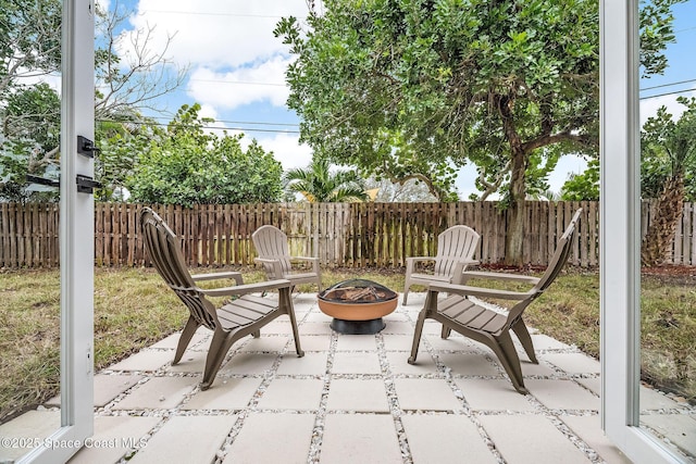 view of patio / terrace with an outdoor fire pit