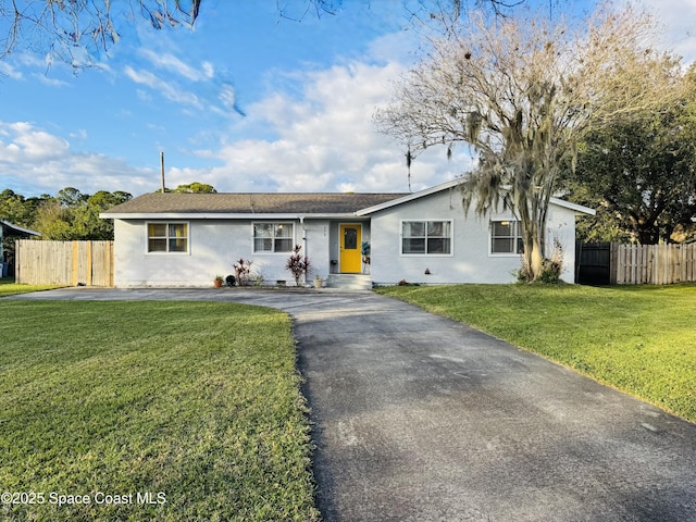 ranch-style home with a front lawn