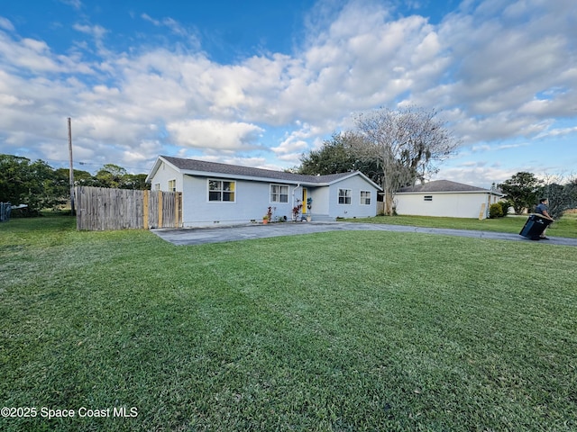 view of front of home with a patio and a front lawn