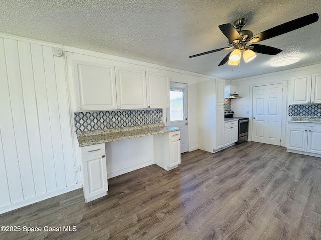 kitchen featuring white cabinetry, built in desk, light hardwood / wood-style floors, and stainless steel range with electric cooktop