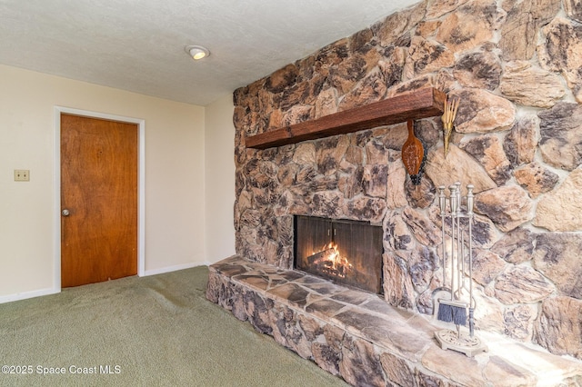 room details with a fireplace, a textured ceiling, and carpet flooring