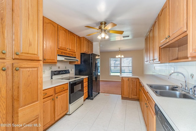 kitchen featuring sink, hanging light fixtures, ceiling fan with notable chandelier, decorative backsplash, and black appliances