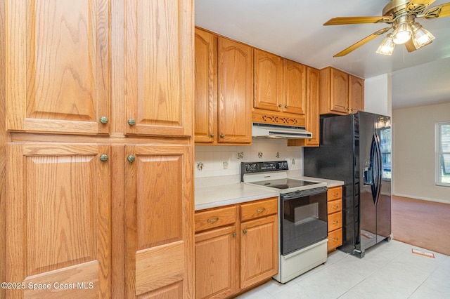 kitchen featuring tasteful backsplash, black refrigerator with ice dispenser, light tile patterned floors, electric range, and ceiling fan