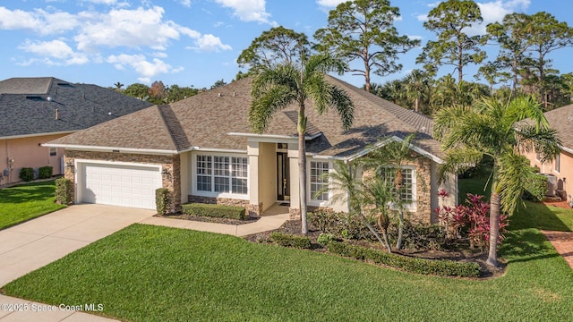 view of front facade with a garage and a front lawn