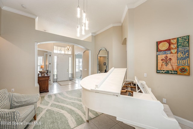 tiled bedroom with an inviting chandelier and ornamental molding