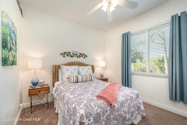 bedroom with ceiling fan and carpet flooring