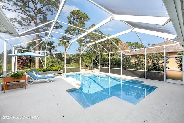 view of pool with a lanai and a patio area