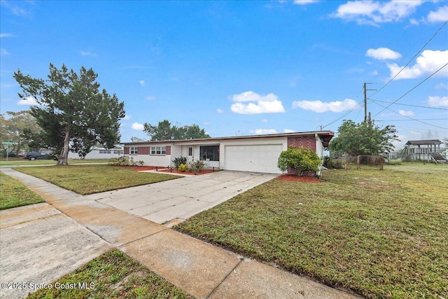 ranch-style home with a garage and a front yard