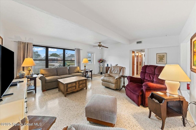 living room with beam ceiling and ceiling fan