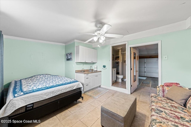 bedroom with connected bathroom, sink, crown molding, light tile patterned floors, and ceiling fan