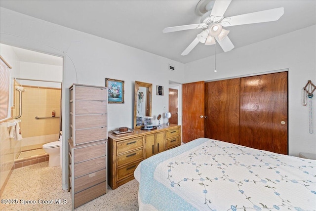 bedroom with ensuite bath, a closet, and ceiling fan