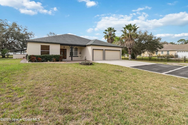 view of front of property featuring a garage and a front lawn