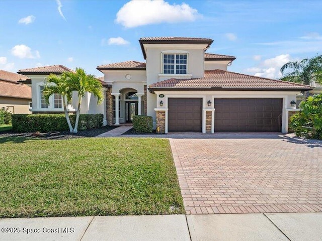 mediterranean / spanish-style house with a garage and a front yard