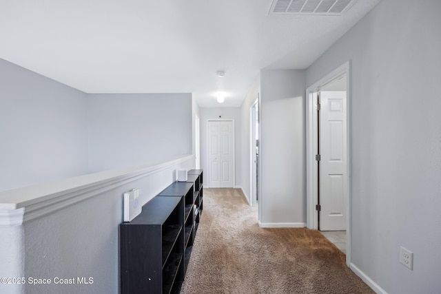 hallway featuring carpet