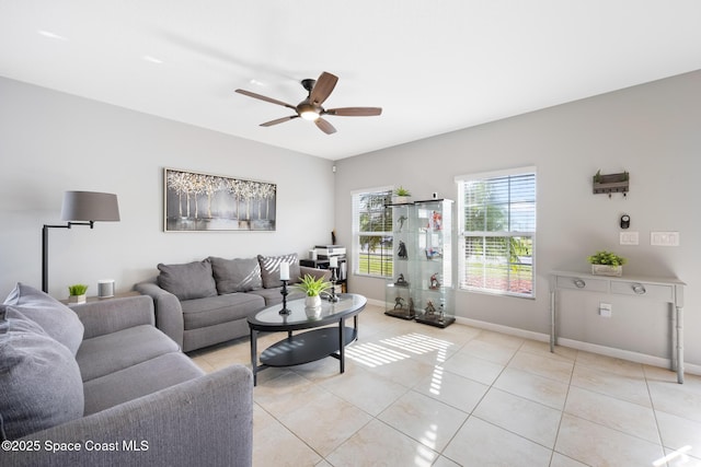 tiled living room featuring ceiling fan