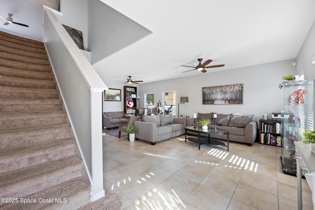 tiled living room featuring ceiling fan