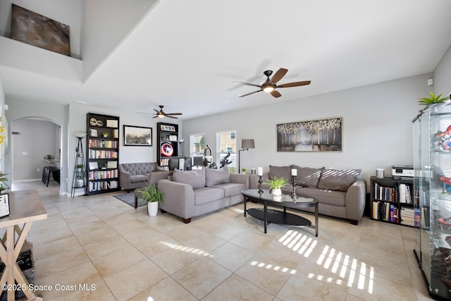 tiled living room with ceiling fan