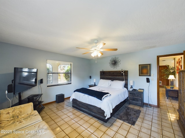 bedroom with light tile patterned floors and ceiling fan