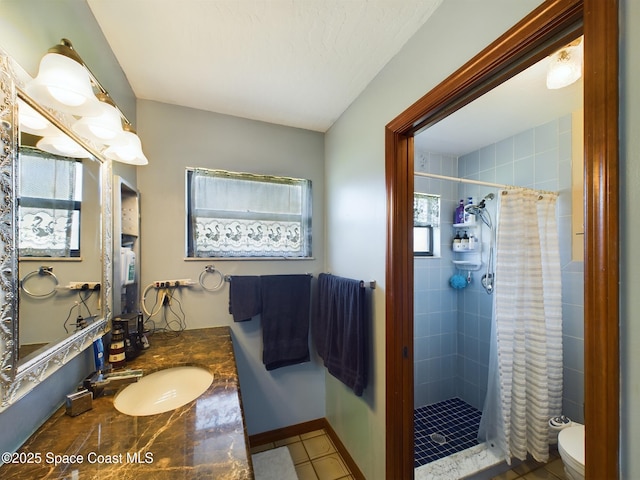 bathroom with a shower with curtain, vanity, and toilet