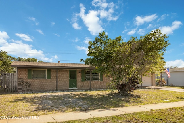 115 Carib Dr, Merritt Island, FL 32952 - view of front of property featuring brick siding, driveway, and a garage