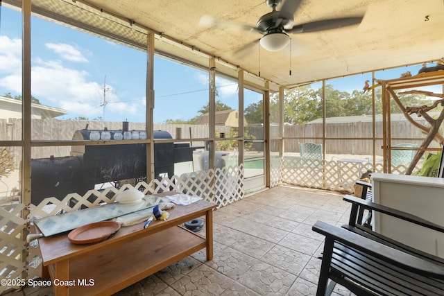 115 Carib Dr, Merritt Island, FL 32952 - sunroom featuring a ceiling fan