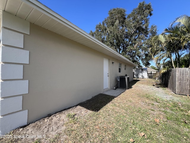 view of side of property with central AC