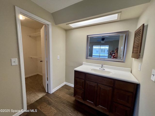 bathroom with vanity and wood-type flooring