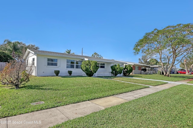 single story home featuring a front lawn