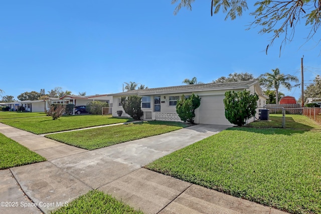 ranch-style house with central AC, a garage, and a front lawn