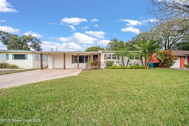 single story home with a garage and a front yard