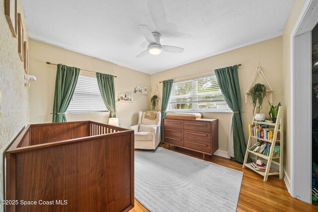 bedroom featuring ceiling fan and light wood-type flooring