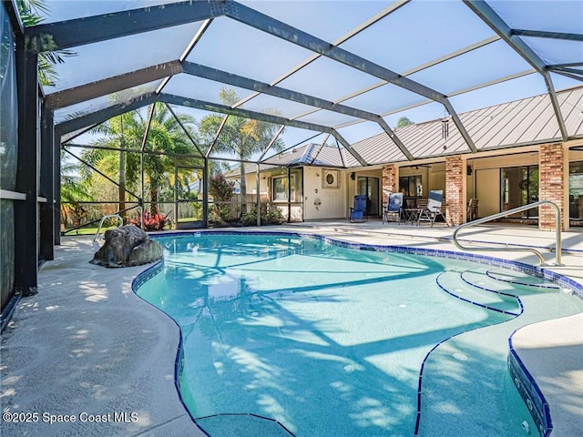 view of pool with a lanai and a patio