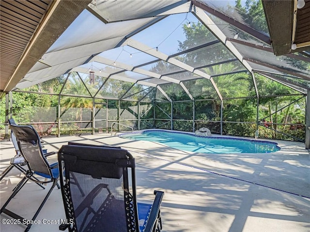 view of pool featuring a lanai and a patio