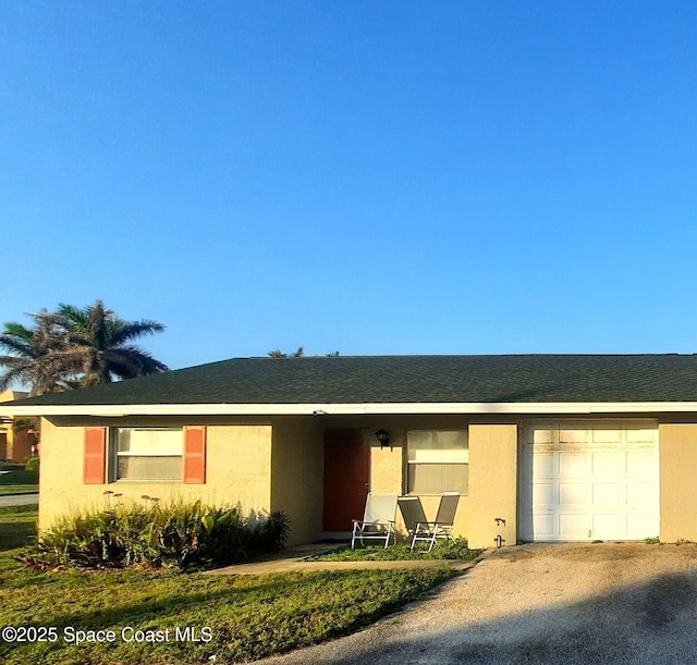 single story home featuring a garage