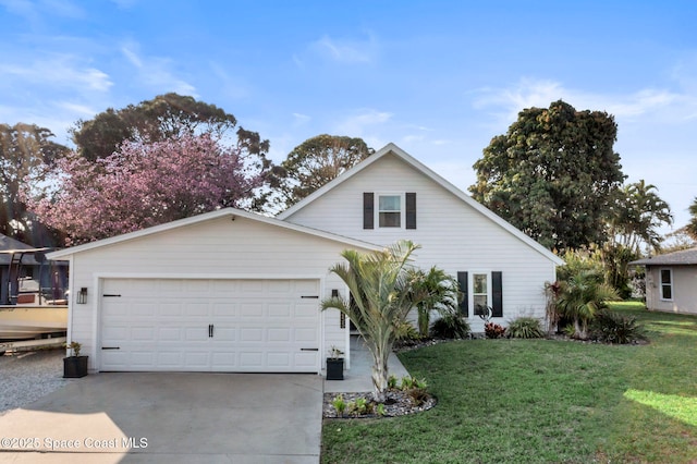 view of front of house with a garage and a front yard