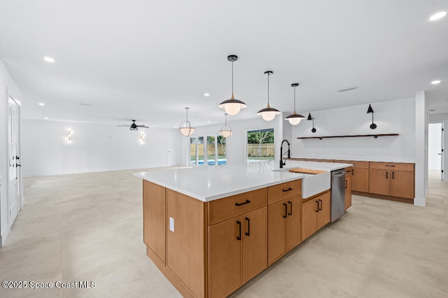 kitchen featuring decorative light fixtures, sink, a large island, stainless steel dishwasher, and ceiling fan