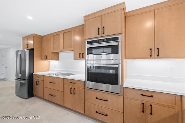 kitchen featuring appliances with stainless steel finishes and light brown cabinetry