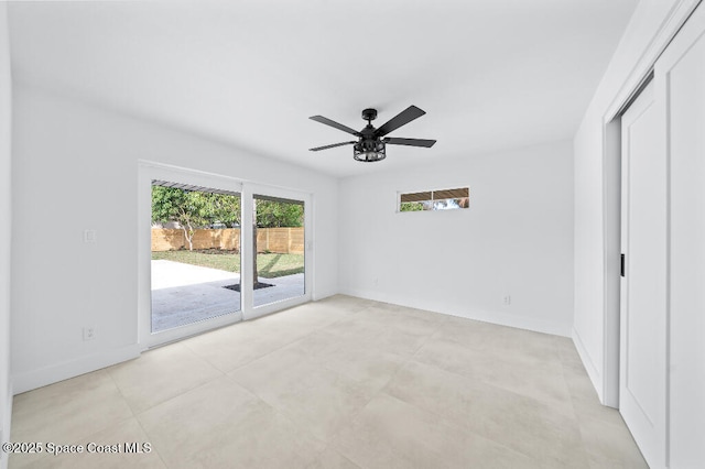 unfurnished bedroom with ceiling fan and access to exterior