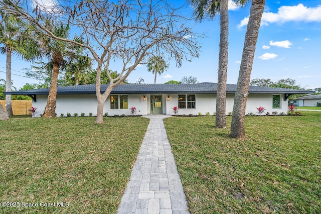 ranch-style home with a front lawn