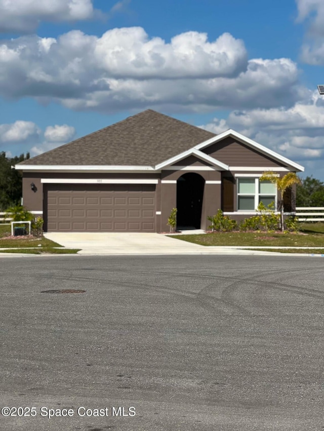 ranch-style home with a garage