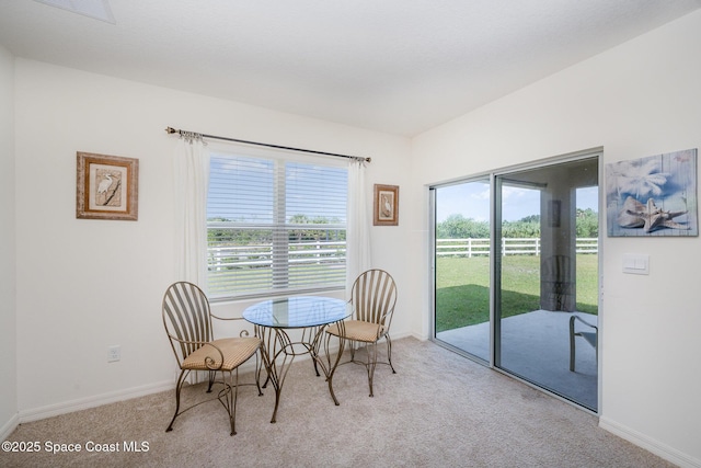 view of carpeted dining space