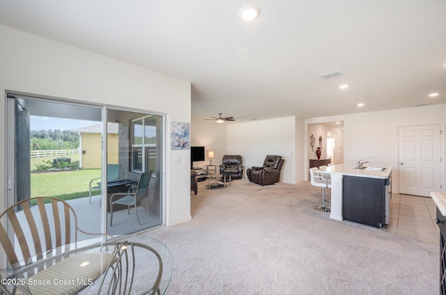 interior space with ceiling fan and sink