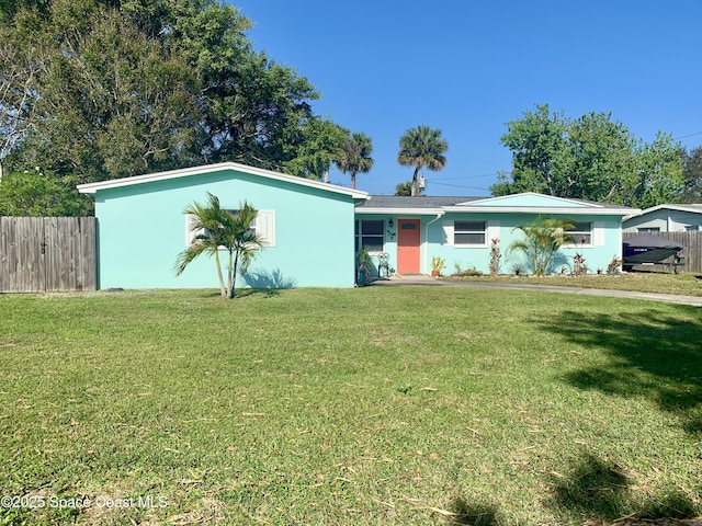 ranch-style home with a front lawn