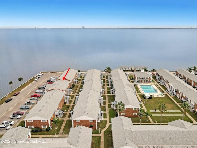 birds eye view of property featuring a water view