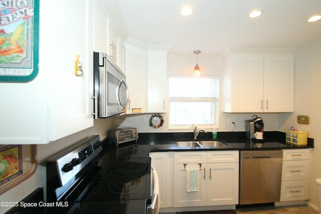 kitchen featuring white cabinetry, sink, and stainless steel appliances