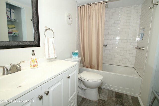 full bathroom featuring hardwood / wood-style flooring, vanity, toilet, and shower / bath combo with shower curtain