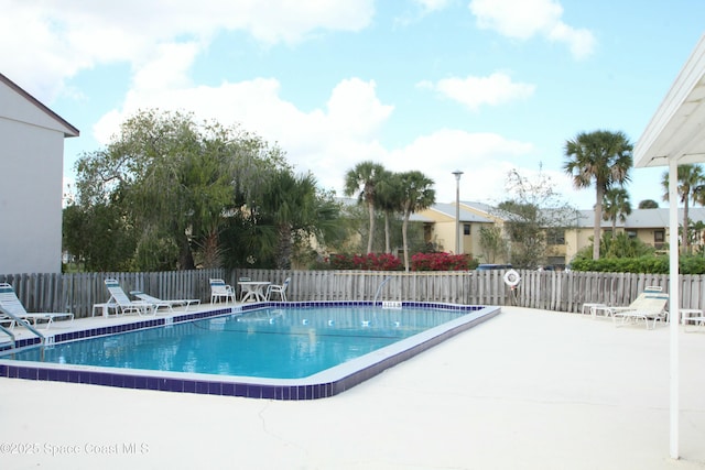 view of swimming pool featuring a patio