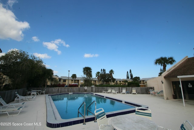 view of swimming pool featuring a patio area