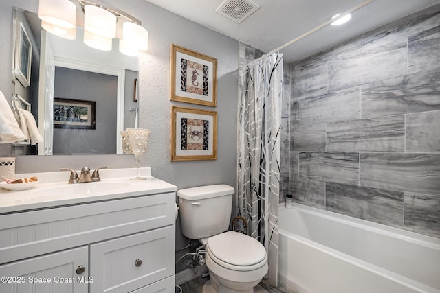 full bathroom featuring shower / tub combo with curtain, vanity, and toilet